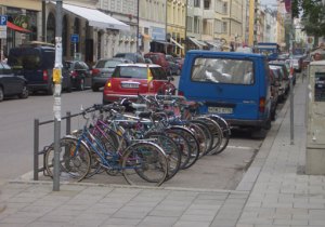 8 bikes parked on the street